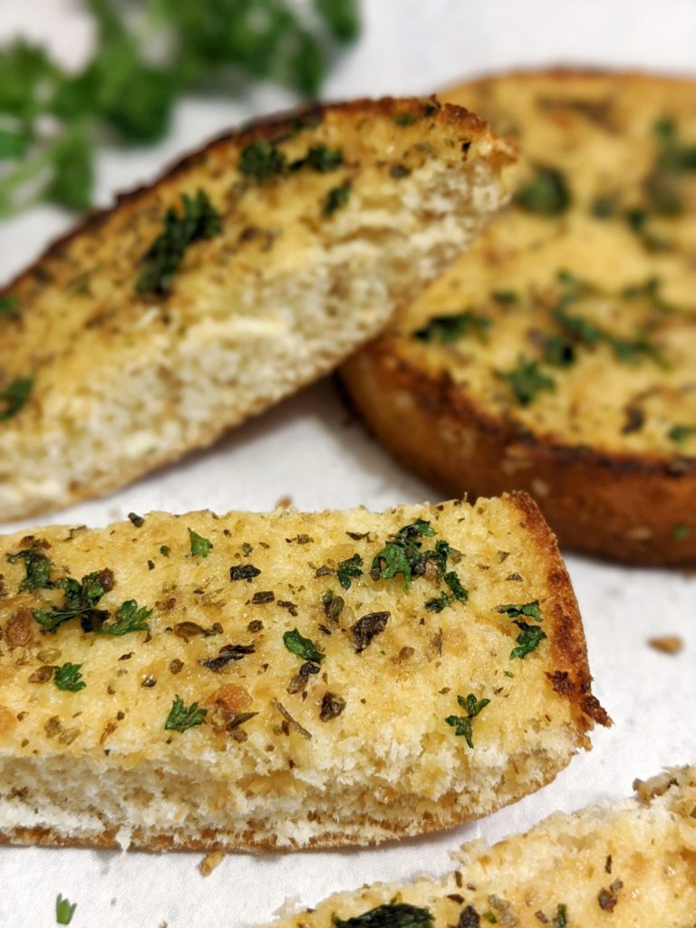 Fast, easy homemade burger bun garlic bread that can be made with rolls, hot dug buns or toast too, and then stored in the freezer after the bake. All the how to on storing leftover cooked garlic bread in here.