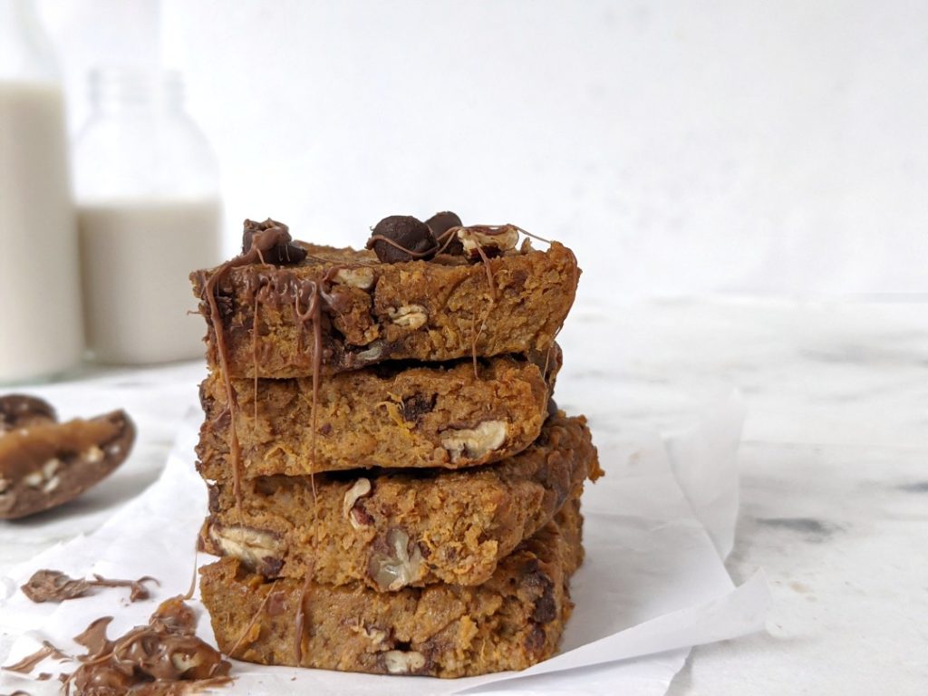 Soft, crunchy and fudgy Sweet Potato Turtle Blondies complete with the chocolate chip, pecan and caramel flavor! Made with almond flour and an almond butter caramel, these sweet potato blondie bars are Paleo friendly too. 