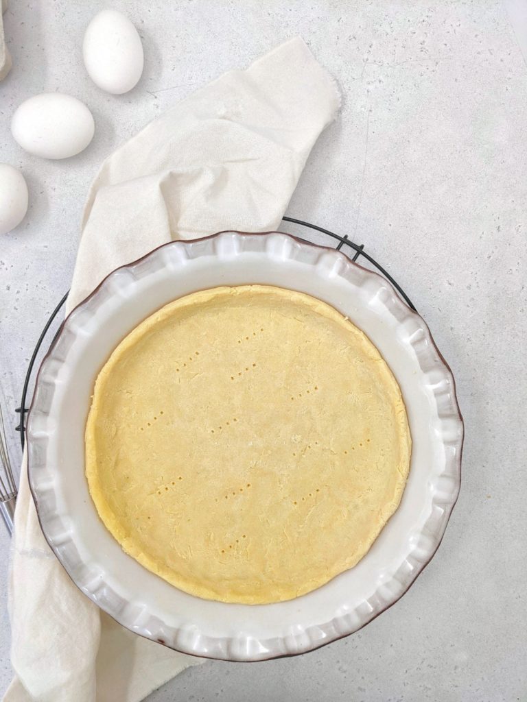 Light and buttery, this Coconut Flour Pie Crust is the perfect base for a keto or low carb pie or quiche recipe. Made with just coconut flour, eggs, butter and salt, it really is easy as pie!