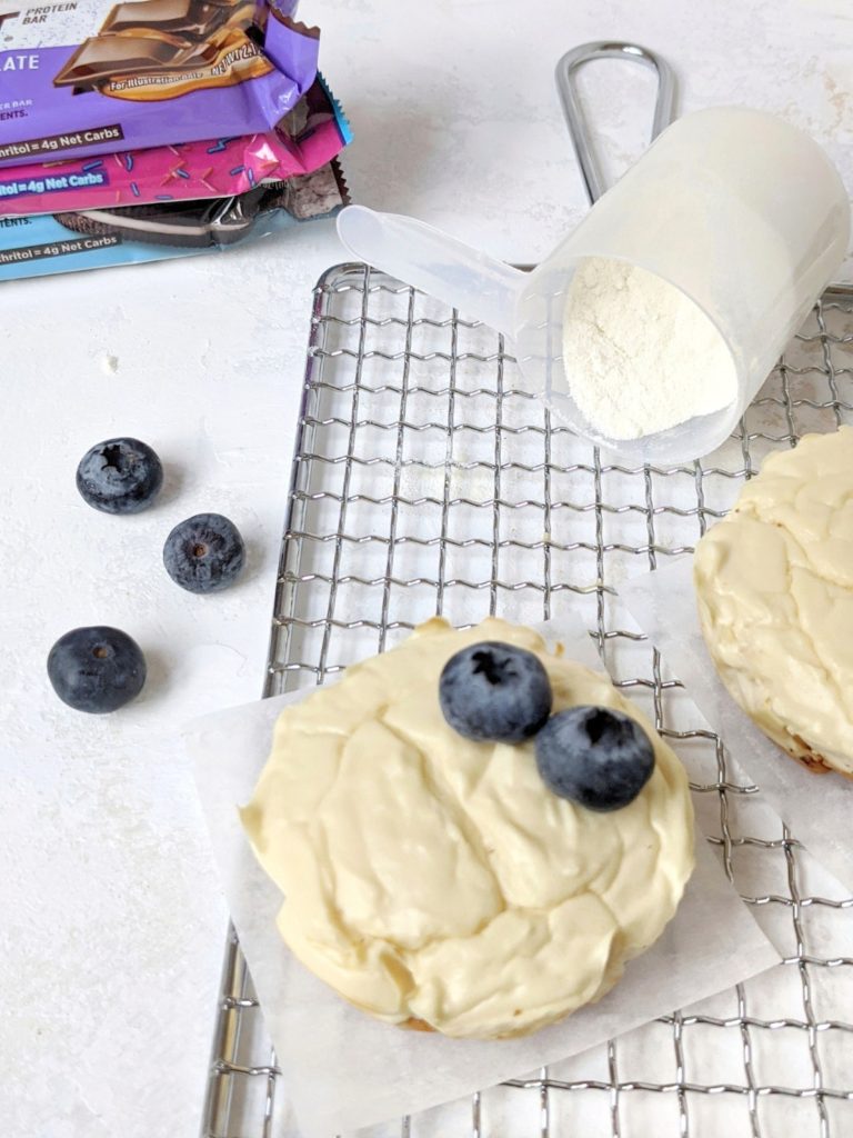 Mini Protein Cheesecakes with a Protein Bar Crust - easy, healthy, high protein cheesecake bites made with greek yogurt and protein powder, and a protein bar for the crust! These mini cheesecakes are made in a muffin tin and perfect for a single serve or small batch baking. Gluten-free and sugar-free too!