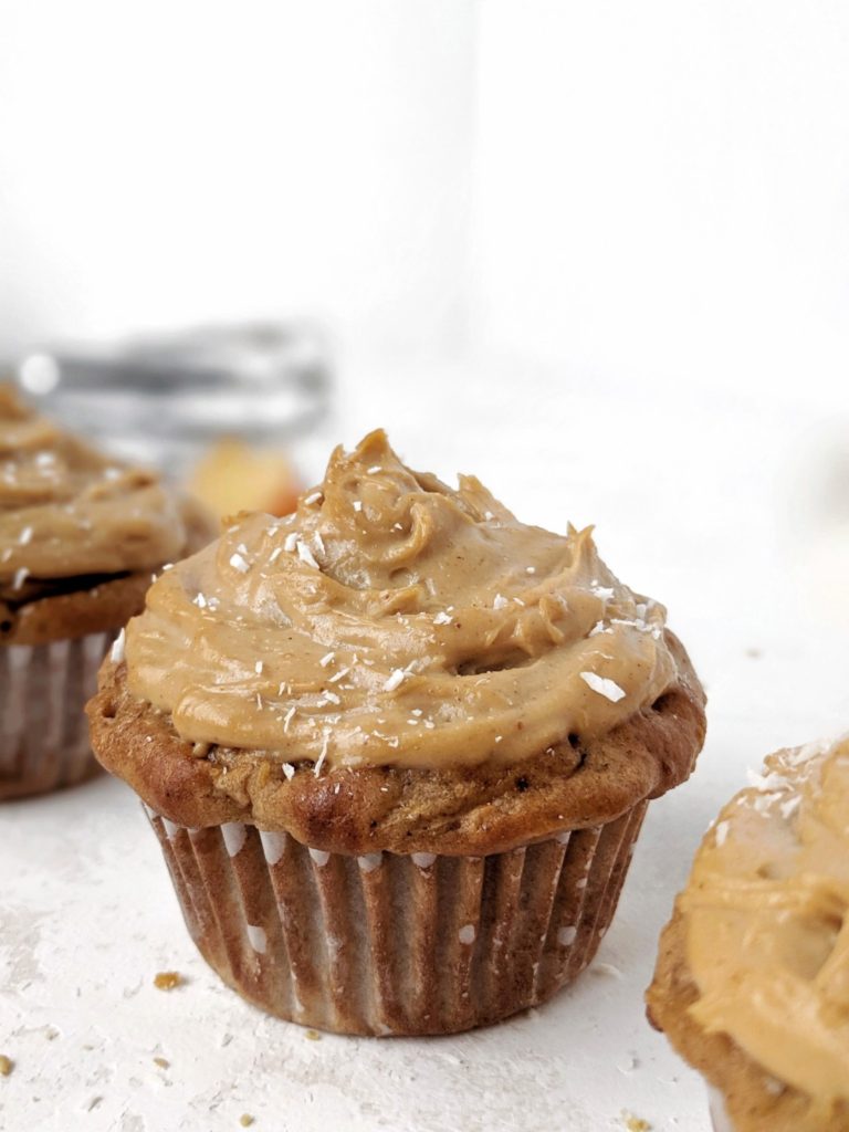 Easy and healthy Protein Apple Cupcakes topped with a Protein Peanut Butter frosting; Made with whole wheat flour, protein powder, greek yogurt and applesauce, these have no oil and are sugar free too! Pipe on some high protein peanut butter frosting and you have the perfect apple cupcake for breakfast or dessert!