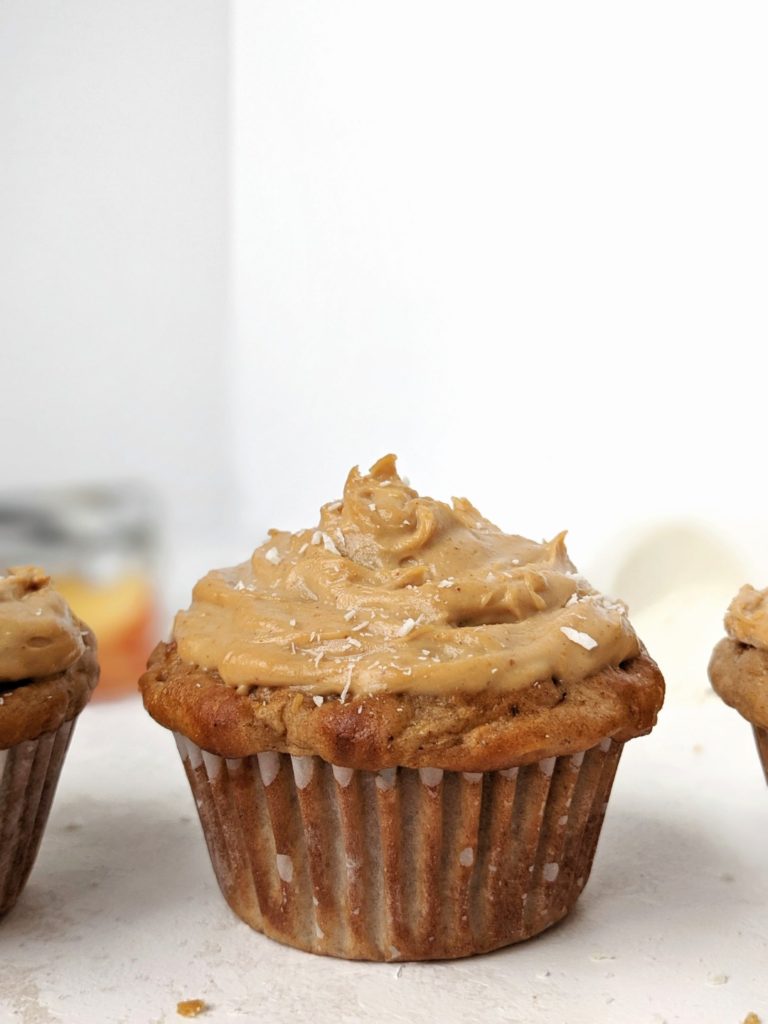 Easy and healthy Protein Apple Cupcakes topped with a Protein Peanut Butter frosting; Made with whole wheat flour, protein powder, greek yogurt and applesauce, these have no oil and are sugar free too! Pipe on some high protein peanut butter frosting and you have the perfect apple cupcake for breakfast or dessert!