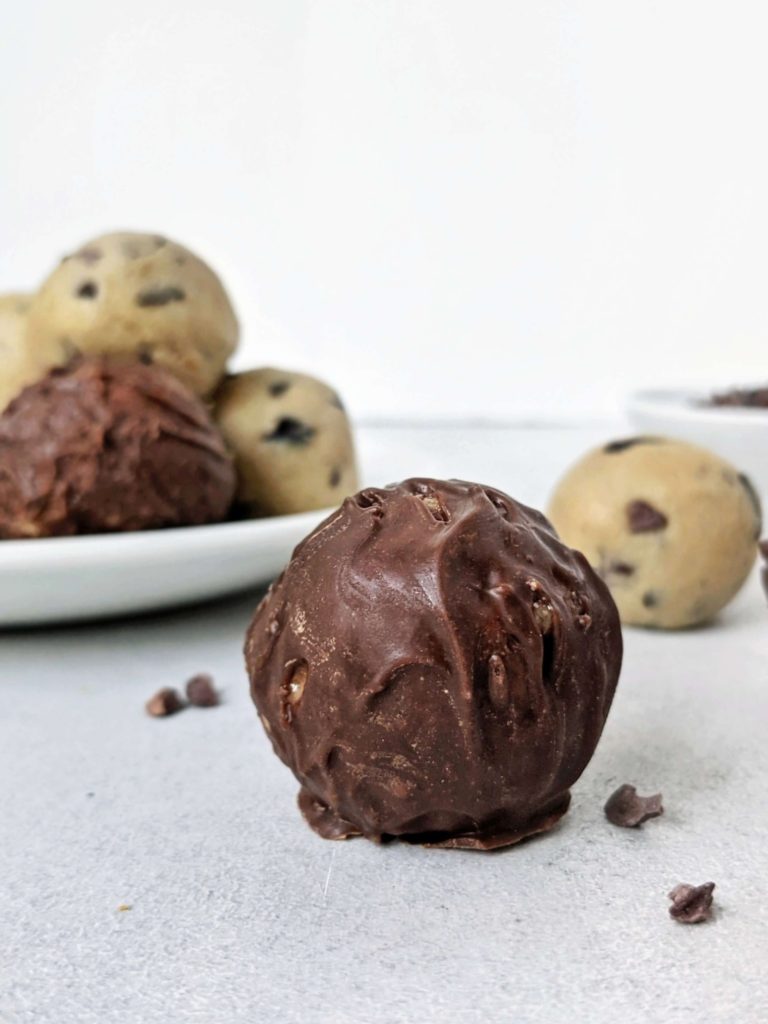 Easy and healthy Low Carb Cookie Dough Protein Balls made with cashew butter, vanilla protein powder, and studded with cacao nibs! No bake cookie dough protein bites are perfect for a Keto, Vegan and Gluten free snack, high protein dessert or energy boost.