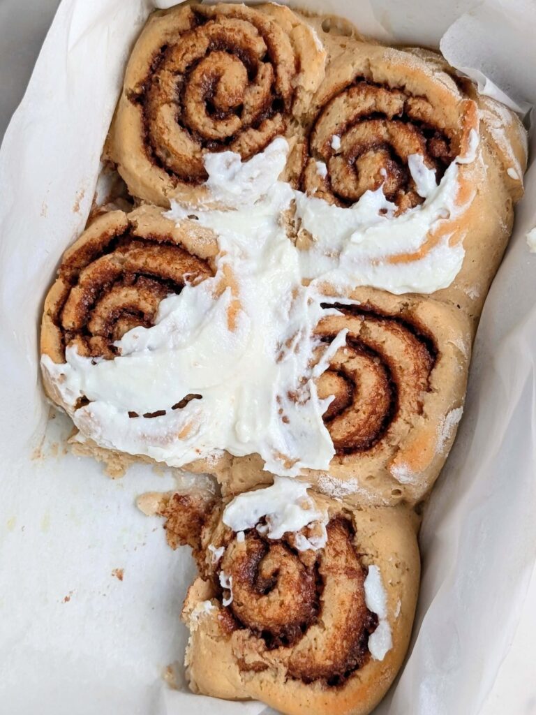 Soft, fluffy but Healthy Protein Cinnamon Rolls topped with protein powder Cream Cheese Icing! These protein powder cinnamon rolls are made with a sugar free filling and icing and only a little butter - the perfect easy, skinny, low calorie cinnamon buns to satisfy your cravings!