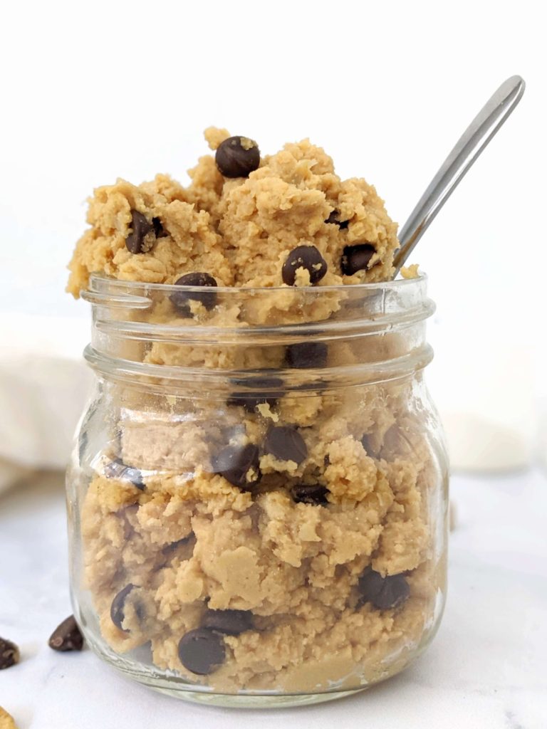 An edible low calorie Protein Chickpea Cookie Dough made with protein powder, peanut butter powder and sugar free chocolate chips. This healthy cookie dough recipe is Vegan and Gluten free too - the perfect protein powder and chickpea dessert.