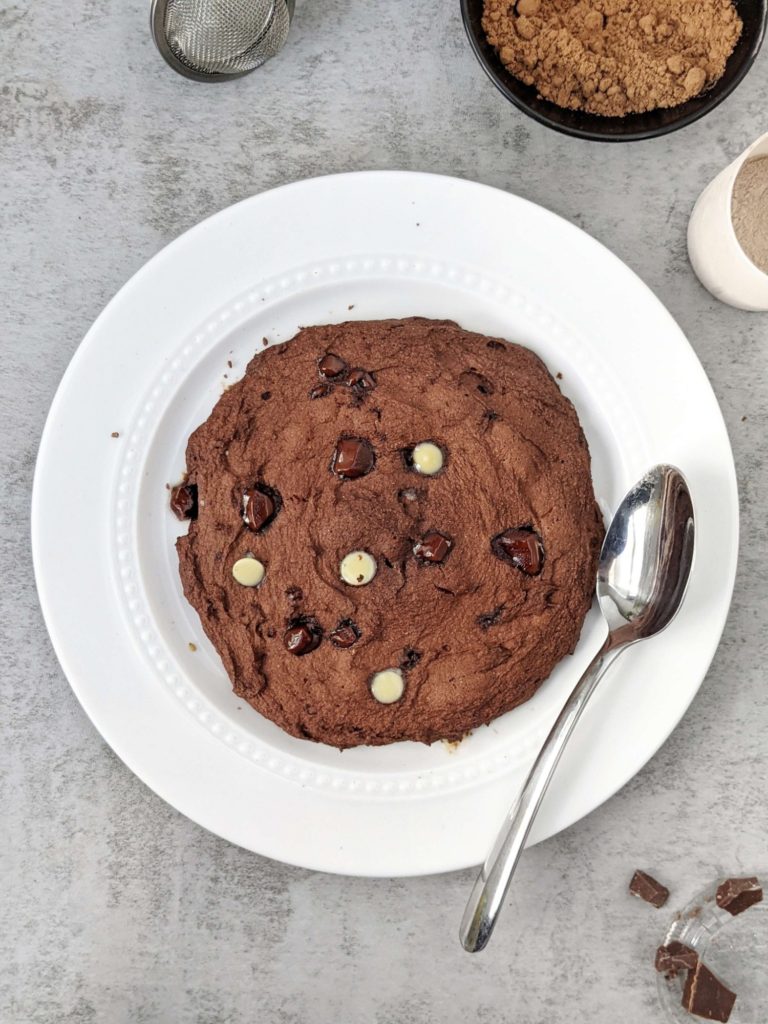 A very Big 6” Double Chocolate Protein Cookie made in the Microwave in under 2 minutes! This single serve protein cookie has no egg, no sugar and no oil; Perfect for a post workout or healthy dessert.