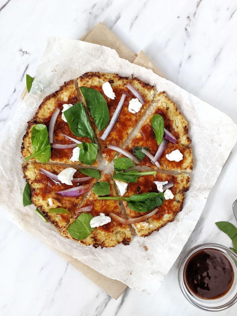 A healthy, low calorie and high protein Cauliflower Chicken Crust Pizza. With no flour and packed with chicken, this is a perfect gluten free, low carb, keto protein pizza crust for all your favorite toppings.