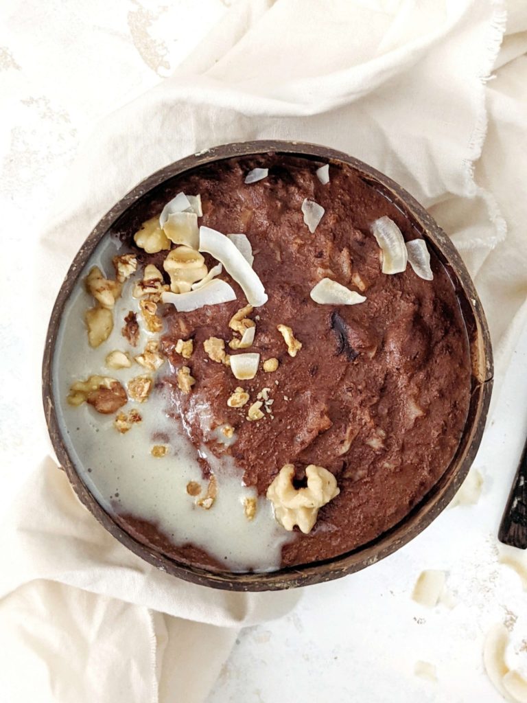 Creamy Chocolate Protein Cauliflower Oatmeal made with cauliflower rice and sweetened with chocolate protein powder for a healthy keto oatless oatmeal. A gluten free, low carb and keto protein oats recipe!