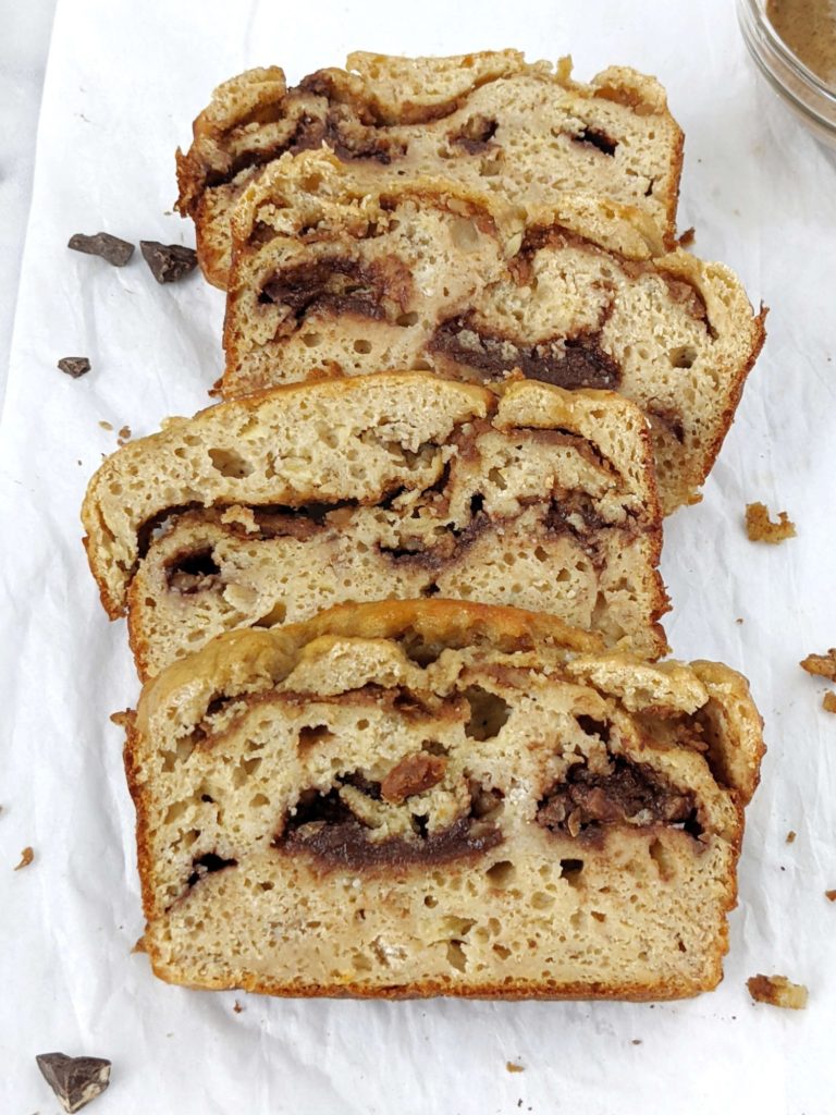 A Double Stuffed but Healthy Protein Banana Bread made with whole wheat flour, protein powder, no oil and no sugar! This oil free high protein banana bread is packed with layers of sugar free chocolate and Biscoff cookie butter and is perfect for a low calorie dessert or breakfast treat.