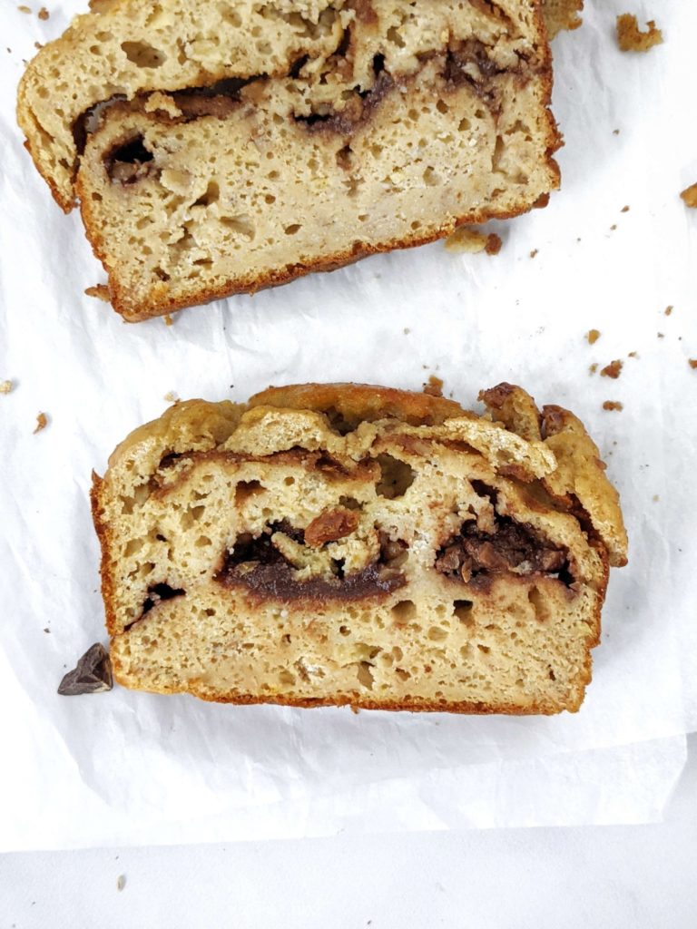 A Double Stuffed but Healthy Protein Banana Bread made with whole wheat flour, protein powder, no oil and no sugar! This oil free high protein banana bread is packed with layers of sugar free chocolate and Biscoff cookie butter and is perfect for a low calorie dessert or breakfast treat.