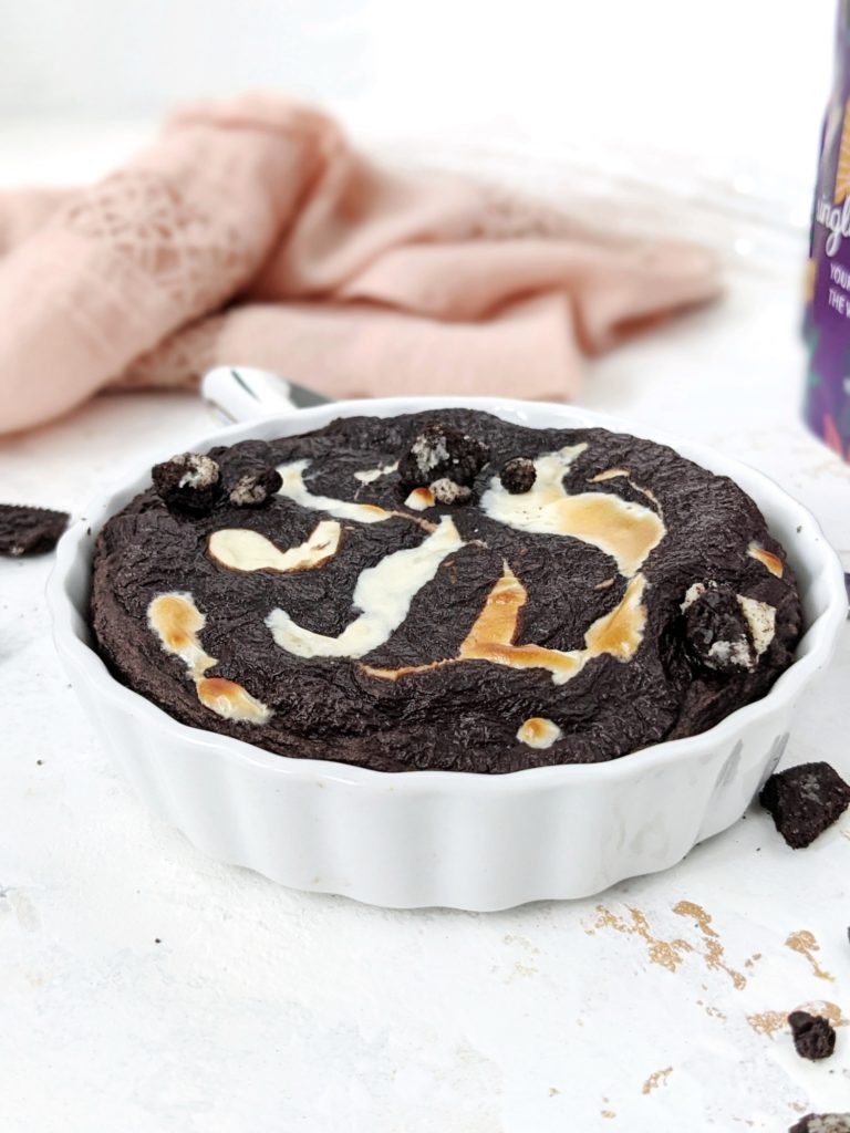 The perfect Protein Cookies and Cream Baked Oats: A sugar-free Oreo protein oatmeal filled with a melty cream cheese center. With the chocolate and cheesecake, this cookies and cream protein powder oatmeal is like having a giant Oreo for breakfast! A gluten free and Vegan option too.