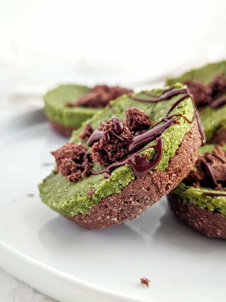 Easy No Bake Matcha Brownie Protein Bites made with oats, protein powder and a few simple ingredients. Matcha Chocolate protein bars are gluten free, sugar free and vegan, and perfect for a quick dessert or snack recipe.