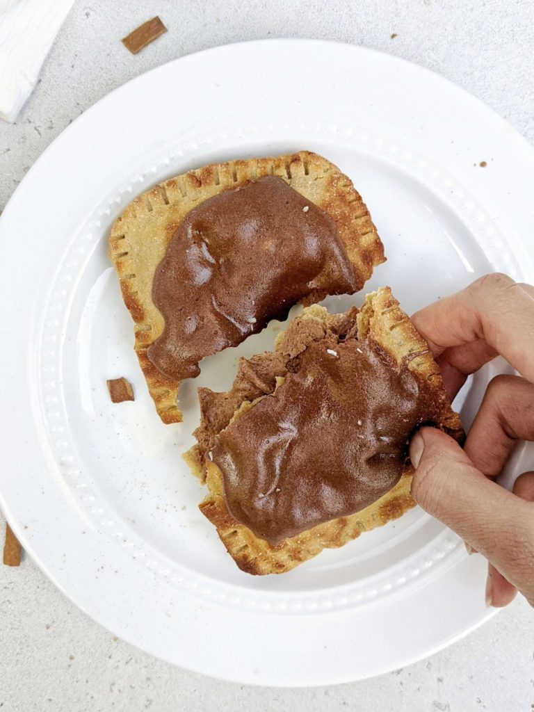 Easy and healthy Brown Sugar Cinnamon Protein Pop Tarts but actually sugar free! This high protein pop tart uses protein powder in the dough, brown sugar cinnamon filling and frosting too.