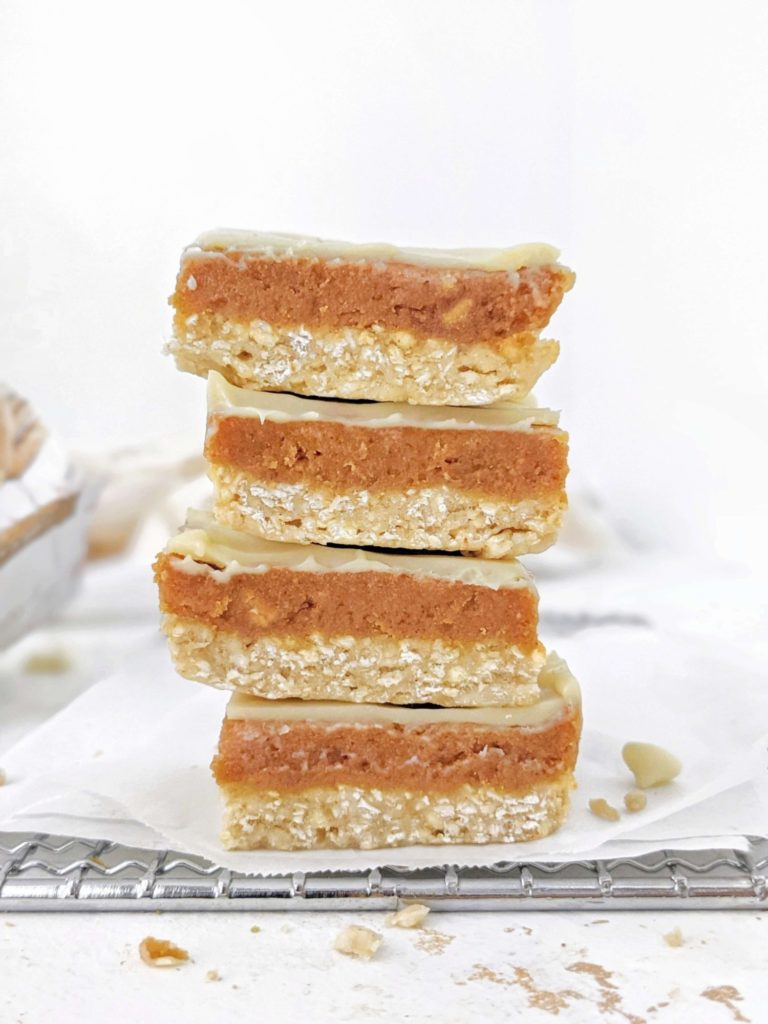 Amazing Healthy Peanut Butter Caramel Slice made with peanut butter powder and protein powder for a high protein, low fat and low calorie recipe. These layered white chocolate peanut butter caramel protein bars are perfect for a vegan, gluten free and sugar free snack, dessert or post workout.