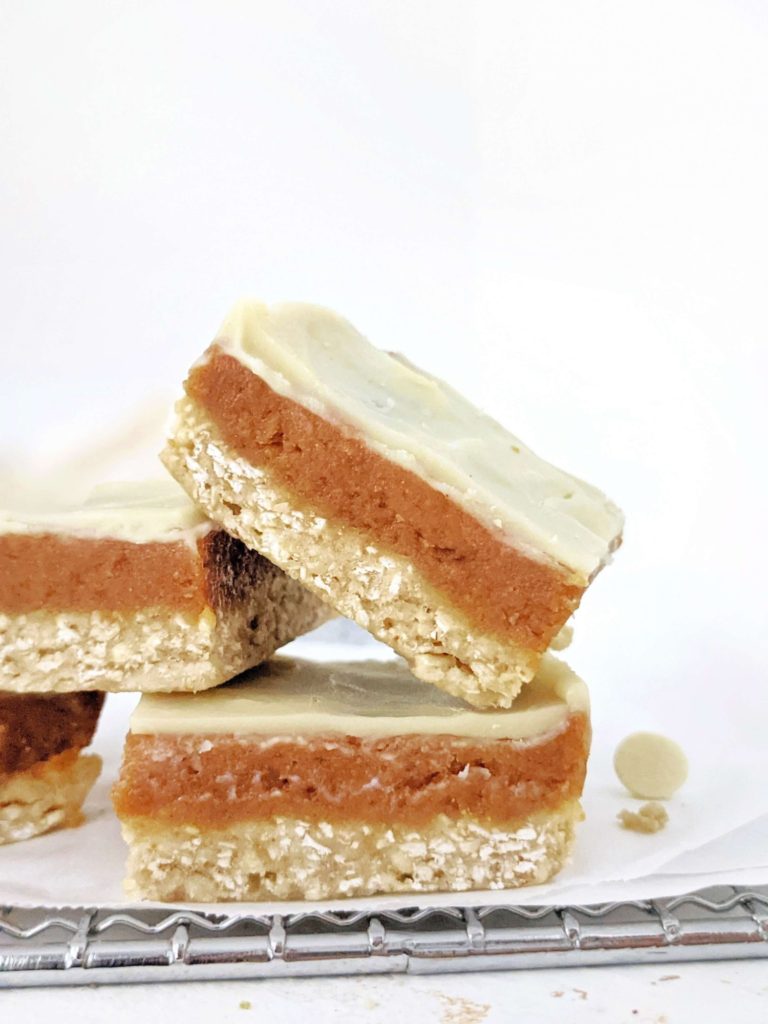 Amazing Healthy Peanut Butter Caramel Slice made with peanut butter powder and protein powder for a high protein, low fat and low calorie recipe. These layered white chocolate peanut butter caramel protein bars are perfect for a vegan, gluten free and sugar free snack, dessert or post workout.