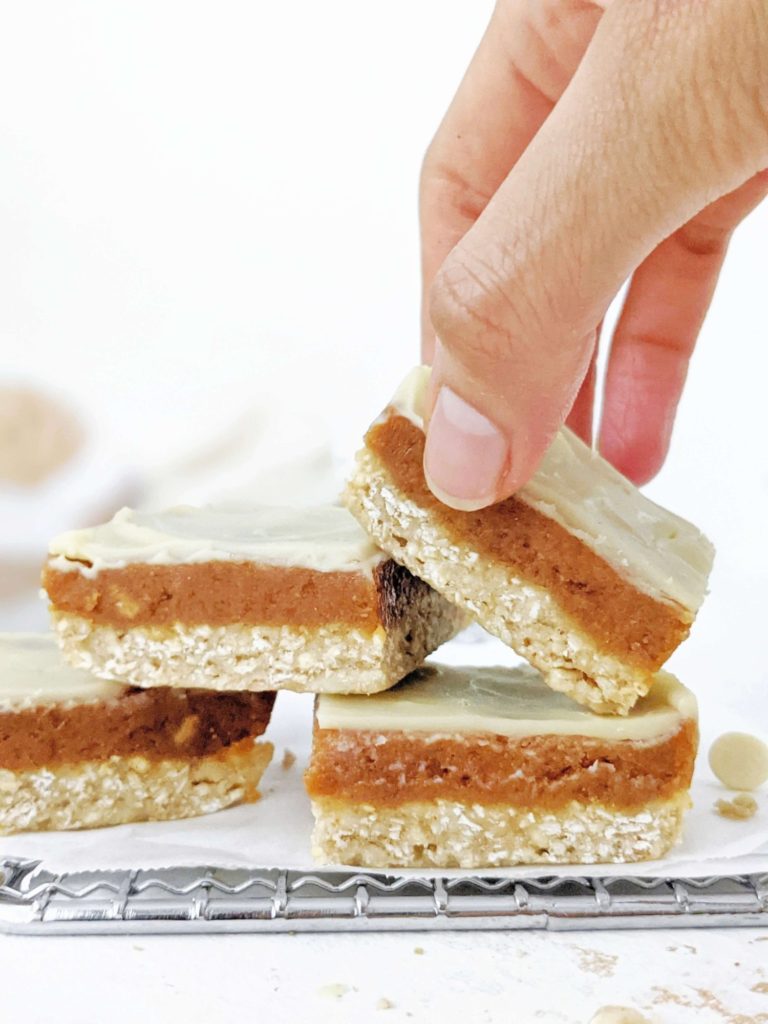 Amazing Healthy Peanut Butter Caramel Slice made with peanut butter powder and protein powder for a high protein, low fat and low calorie recipe. These layered white chocolate peanut butter caramel protein bars are perfect for a vegan, gluten free and sugar free snack, dessert or post workout.