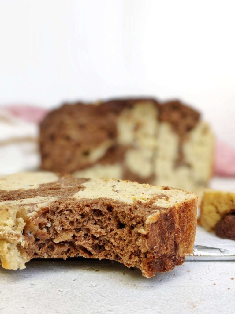 An attractive Marbled Protein Banana Bread made healthy with no oil, butter or sugar! This healthy chocolate swirl protein banana bread uses whole wheat pastry flour, Greek yogurt, protein powder and cocoa powder for all the flavor with no health compromises.