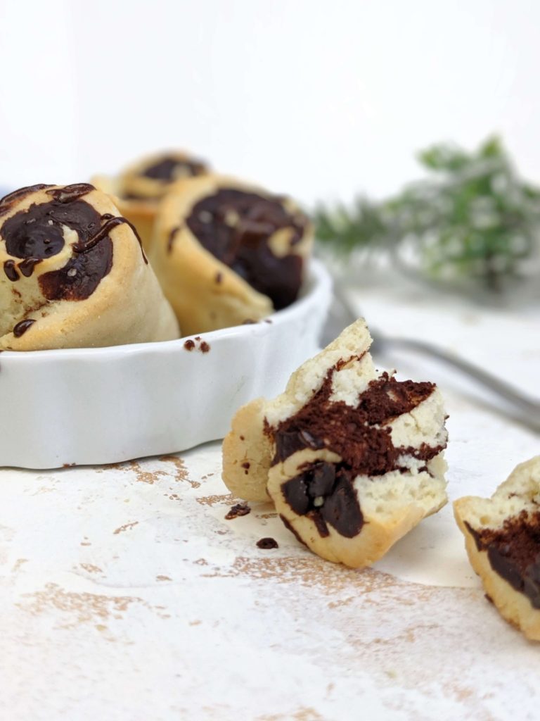 Unbelievably soft and fluffy Mini Protein Chocolate Cinnamon Rolls with all the chocolate rolls flavor but actually healthy! Protein chocolate sweet rolls use protein powder for a sweetener, have no yeast, are low calorie and have a Vegan option too!