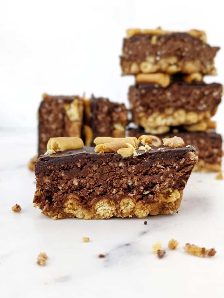 Beautiful layered Pretzel Protein Fudge Bars with the perfect sweet-salty and crunchy-fudgy combination! Chocolate pretzel protein bars are easy, healthy and sugar free; Perfect for a homemade on-the-go snack or post-workout treat!