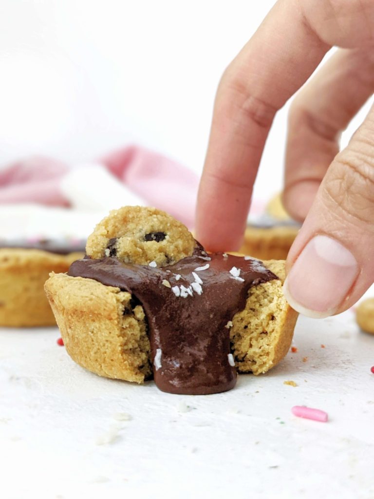 Just amazing Protein Cookie Cups with a protein chocolate filling - but still sugar free! Protein packed cookie dough cups are made with simple ingredients, are gluten free and easily Vegan too.