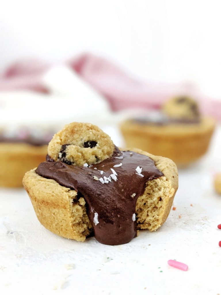 Just amazing Protein Cookie Cups with a protein chocolate filling - but still sugar free! Protein packed cookie dough cups are made with simple ingredients, are gluten free and easily Vegan too.