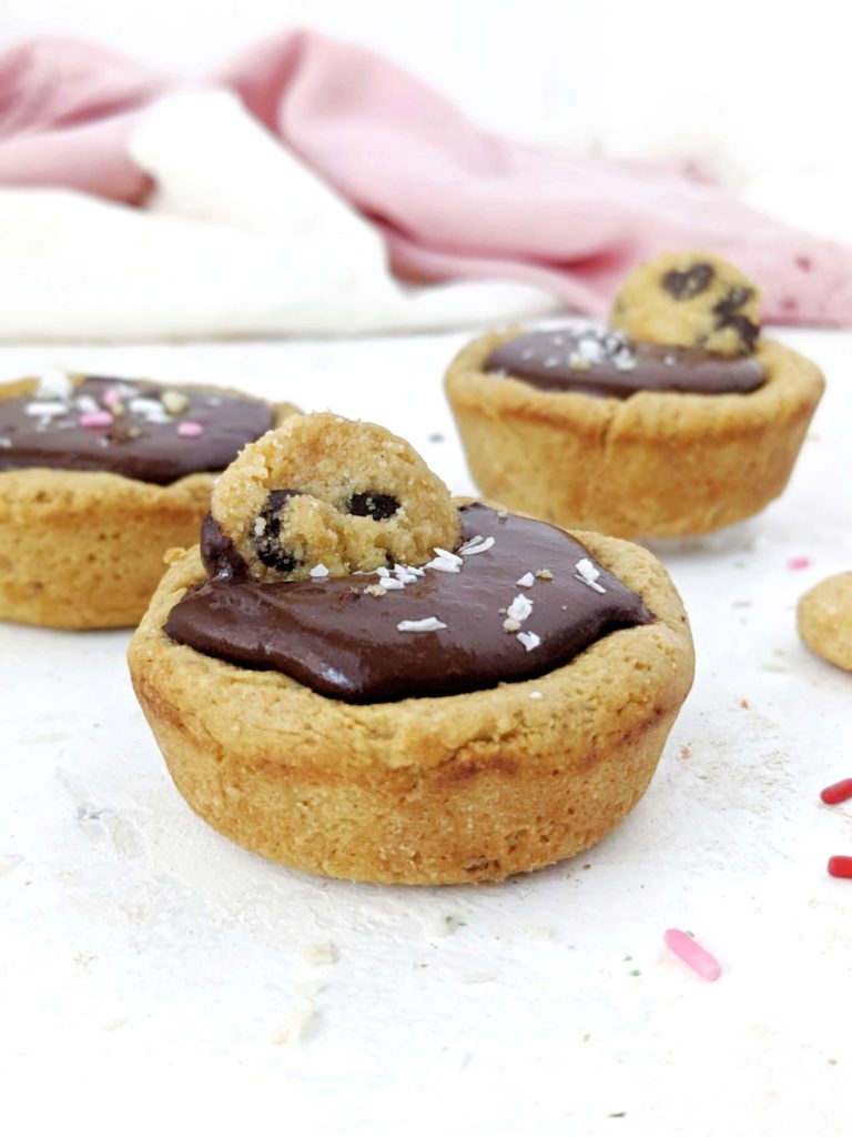 Just amazing Protein Cookie Cups with a protein chocolate filling - but still sugar free! Protein packed cookie dough cups are made with simple ingredients, are gluten free and easily Vegan too.