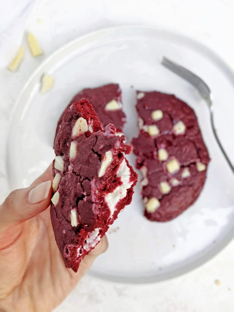 An indulgent single serve Cheesecake Stuffed Red Velvet Protein Cookie - A red velvet protein powder cookie with a protein cheesecake filling. This protein red velvet cheesecake cookie is gluten free, sugar free, has no egg and can be made Vegan too; The perfect protein dessert!