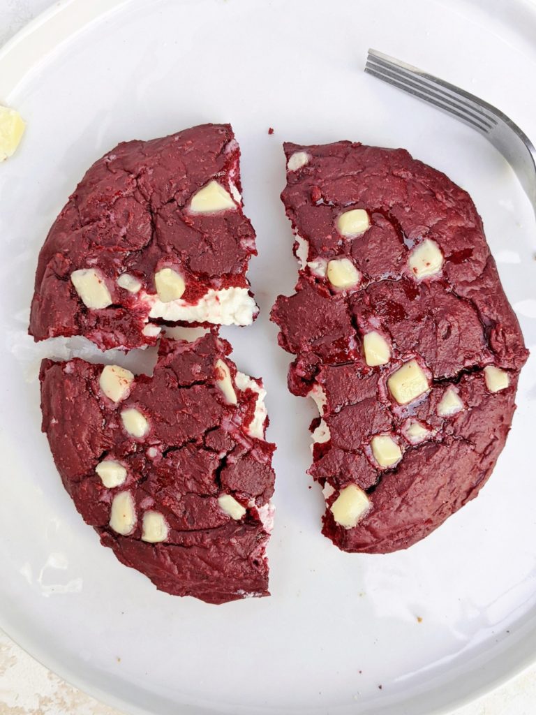 An indulgent single serve Cheesecake Stuffed Red Velvet Protein Cookie - A red velvet protein powder cookie with a protein cheesecake filling. This protein red velvet cheesecake cookie is gluten free, sugar free, has no egg and can be made Vegan too; The perfect protein dessert!