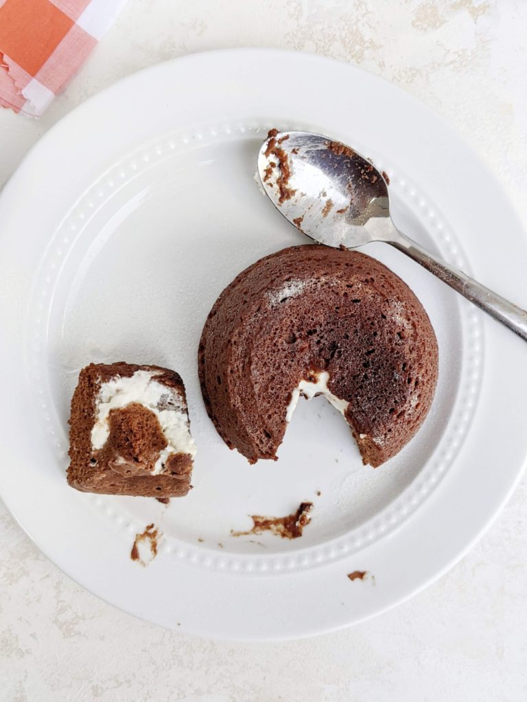 Get 2 desserts in 1 and for one with this Chocolate Cheesecake Protein Mug Cake, but still keep it sugar free and healthy. A high protein chocolate cream cheese mug cake made with whole wheat pastry flour and protein powder, and filled with a low fat Greek yogurt-cream cheese mixture.