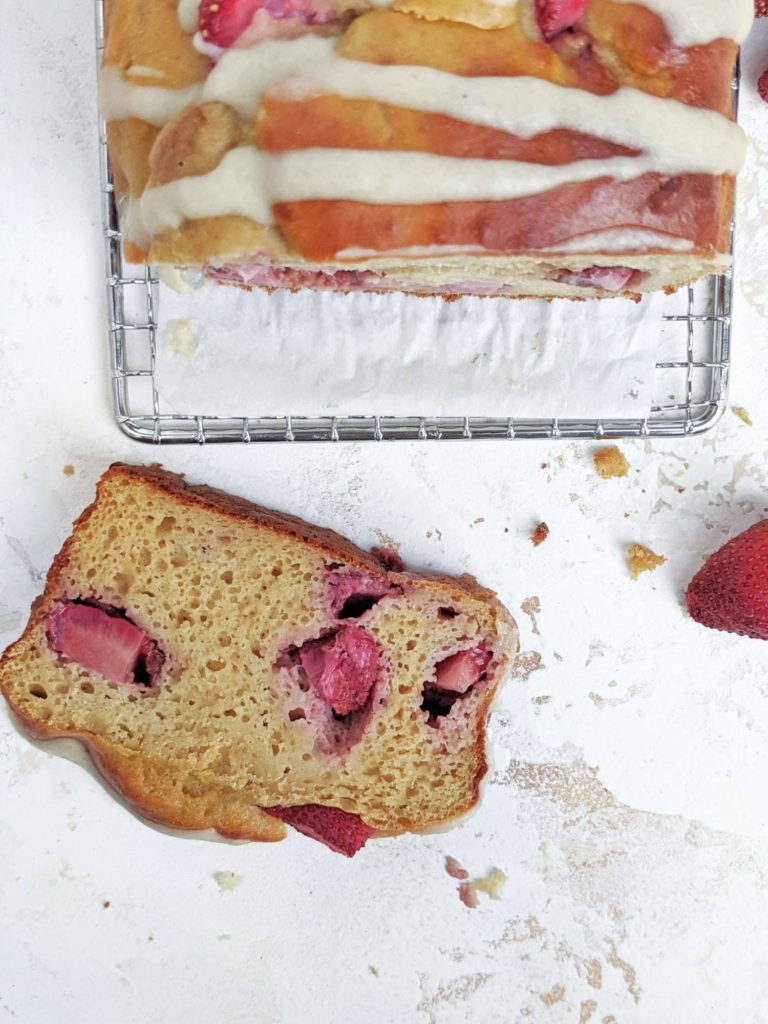 A pretty and pretty healthy Protein Strawberry Bread made with whole wheat flour and only a bit of oil. This low calorie healthy strawberry loaf bread is sweetened with protein powder and is perfect for a sugar free breakfast, dessert, snack or post workout!