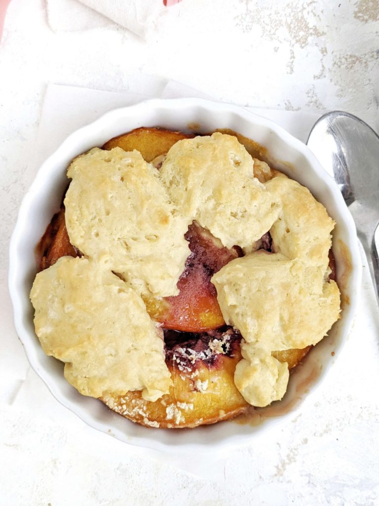 A beautiful High Protein Peach Cobbler for One to satisfy the cravings. This single serving healthy peach cobbler uses protein powder in the filling and cobbler and has no sugar at all!