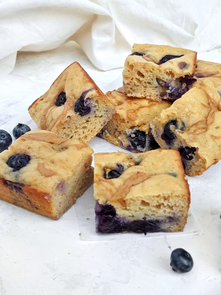 A light, fluffy and super easy Peanut Butter Blueberry Protein Cake for a perfect blueberry dessert recipe. This healthy blueberry cake is made with protein powder, Greek yogurt, and monk fruit for a low sugar breakfast cake. Gluten free and a Vegan option too.