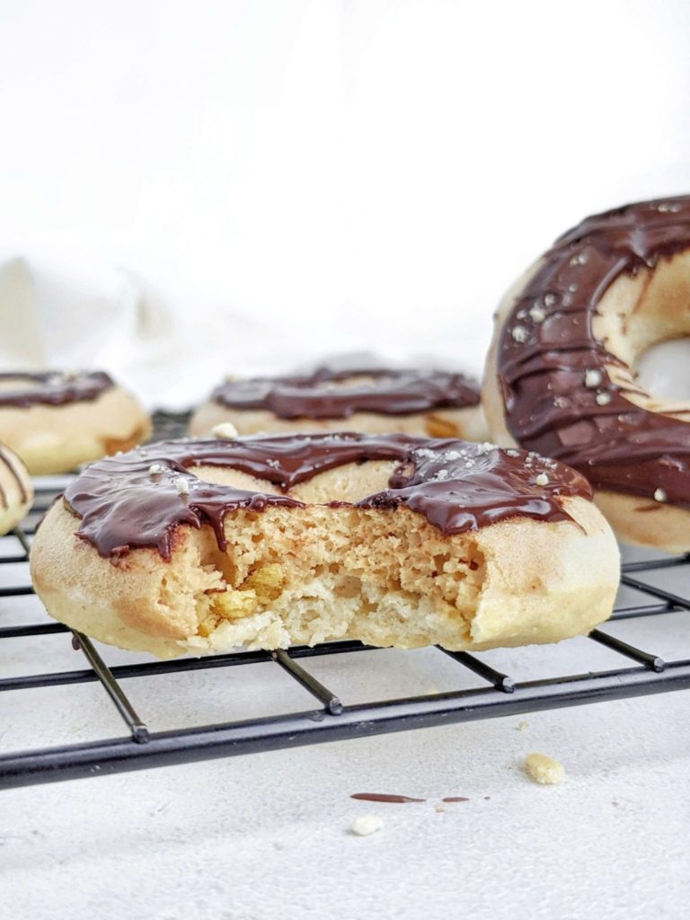 Realistic Twix Protein Donuts with vanilla and peanut butter caramel donut layers, chocolate glaze, and actual shortbread too! Healthy copycat Twix donuts use protein powder and are sugar free and low fat too.