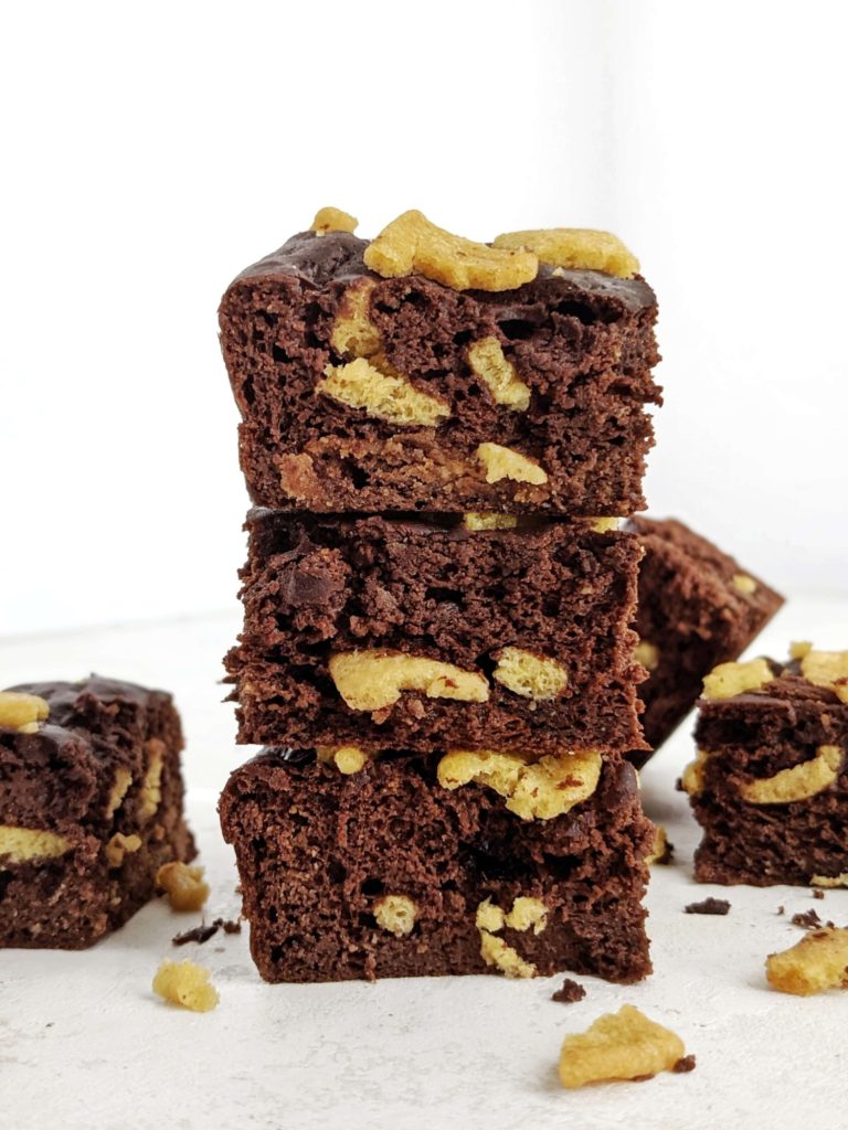 Soft, light and fluffy, these are the best Chocolate Protein Cake Bars you can make! This dark chocolate protein powder cake bar recipe uses a lot of cocoa powder, Greek Yogurt and has no oil, eggs or sugar either!