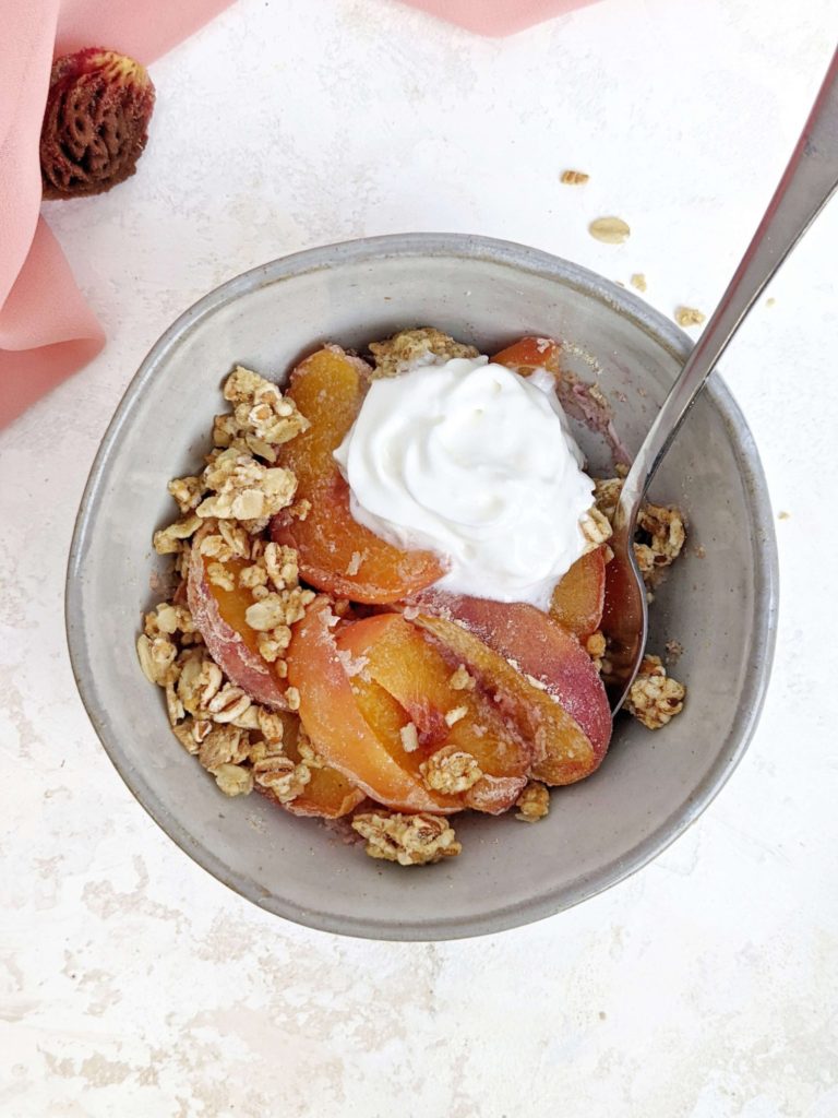 A quick, hacky and healthy Single Serve Peach Crisp made in the microwave and topped with granola! This high protein peach crisp for one uses protein powder and is truly a great healthy and sugar free individual mini dessert!