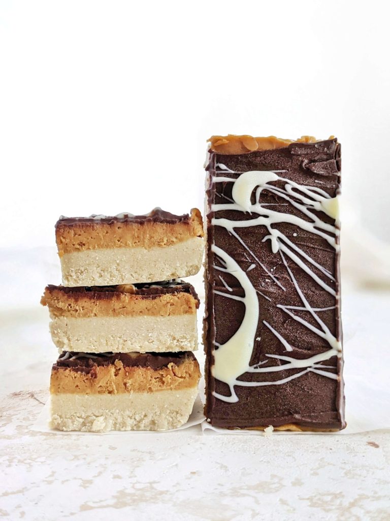 Amazing Protein Millionaire Shortbread bars made low calorie with protein powder and peanut butter, with no condensed milk. These healthy millionaire shortbread protein bars are perfect for a homemade snack or dessert; Vegan too!