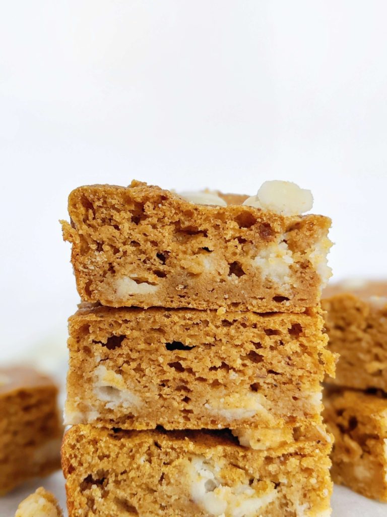 White Chocolate Pumpkin Protein Blondies loaded with pumpkin spice - a fall-perfect pumpkin dessert! These healthy pumpkin protein powder blondies are gluten free, Vegan and low calorie too!