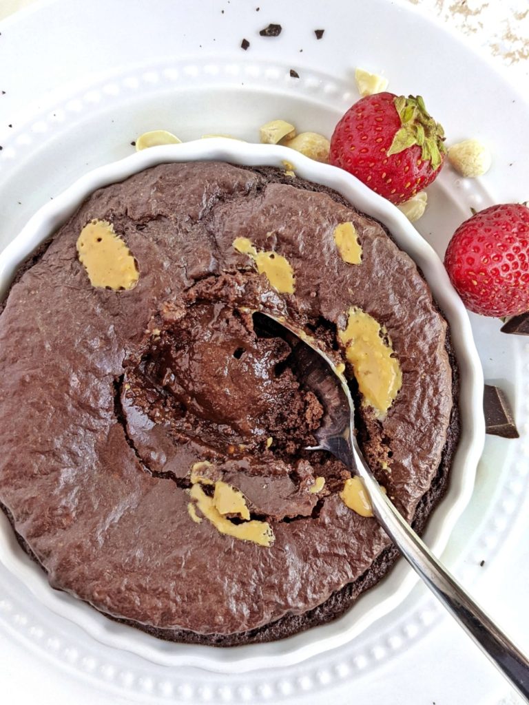 A half baked Peanut Butter Protein Brownie for one with a fudgy gooey center. This healthy peanut butter brownie uses peanut butter powder and protein powder for a rich, single serve dessert.