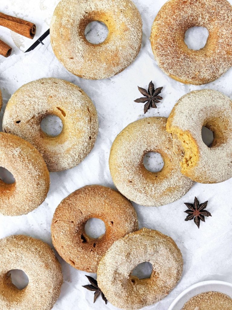 Fluffy and flavorful Chai-spiced Pumpkin Protein Donuts with a protein cinnamon sugar coating are the perfect Fall baked donuts! Healthy pumpkin protein powder donuts are sugar free and gluten free and will be your new favorite.