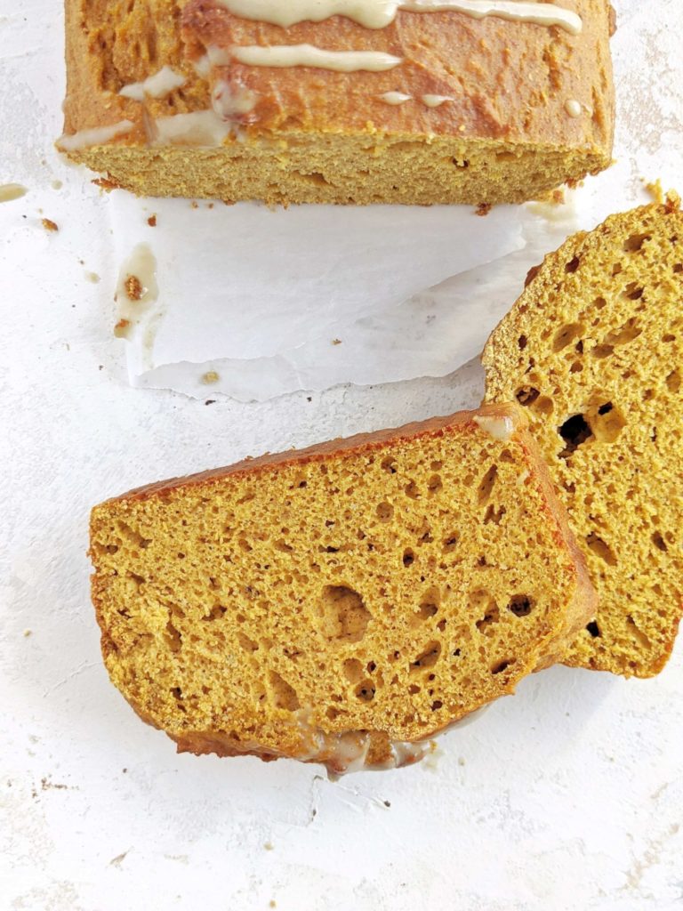 A super cozy Pumpkin Protein Pancake Bread topped with a maple cashew glaze! This healthy pumpkin pancake bread uses protein pancake mix, protein powder, sugar free maple syrup and no oil or butter. A delicious breakfast loaf for fall!