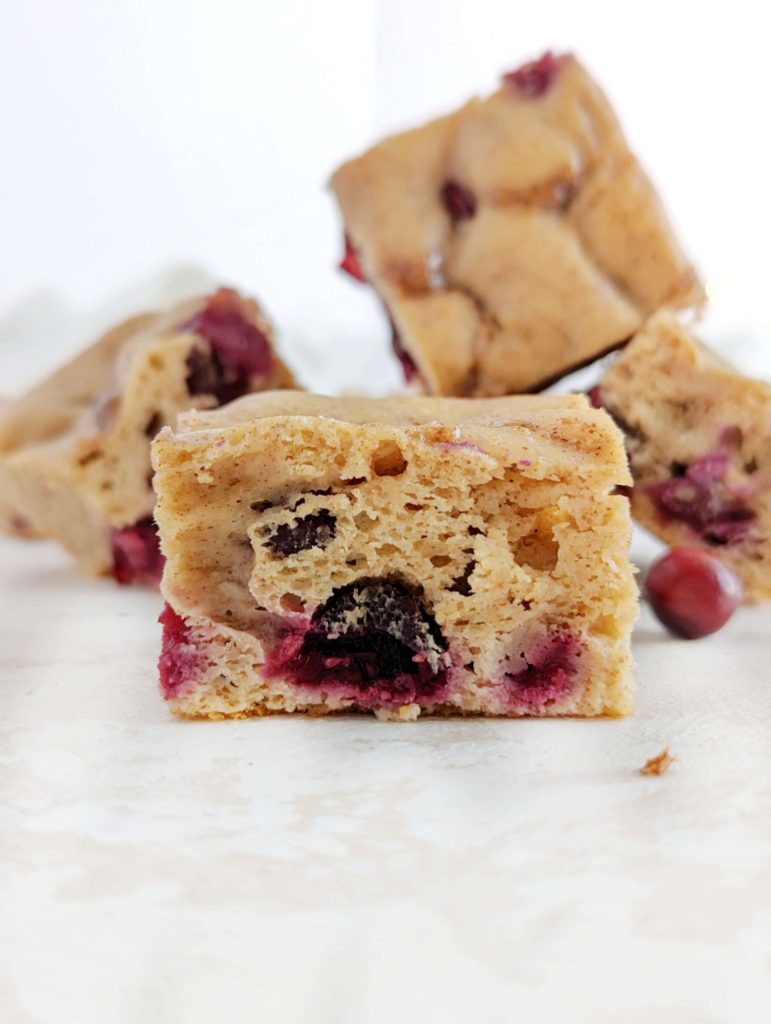 A sweet and tarty Cinnamon Cranberry Protein Cake loaded with fresh cranberries for a great winter dessert recipe! This healthy cranberry cake uses protein powder, monkfruit and Greek yogurt, has no eggs, butter or oil, and is gluten free too. 