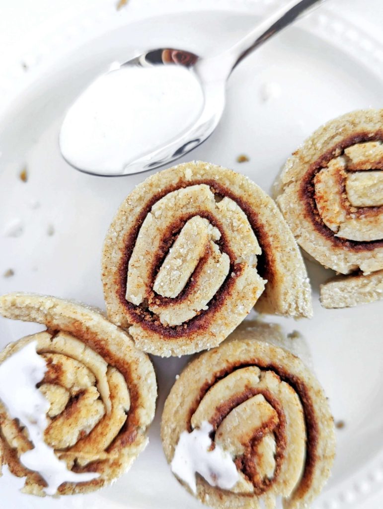 Spot on No Bake Protein Cinnamon Rolls with the soft and gooey texture, but no oven and no yeast needed. These raw no bake cinnamon rolls use protein powder, monkfruit sweetener and healthy cinnamon almond butter for the perfect snack or post workout treat.