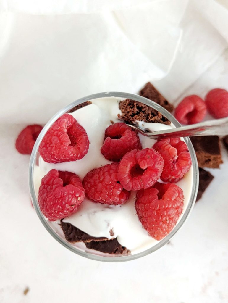 An easy and beautiful Chocolate Raspberry Protein Trifle with protein brownies, a Greek yogurt ‘custard’ and fresh raspberries. This healthy raspberry brownie trifle is sugar free, gluten free and Vegan too!