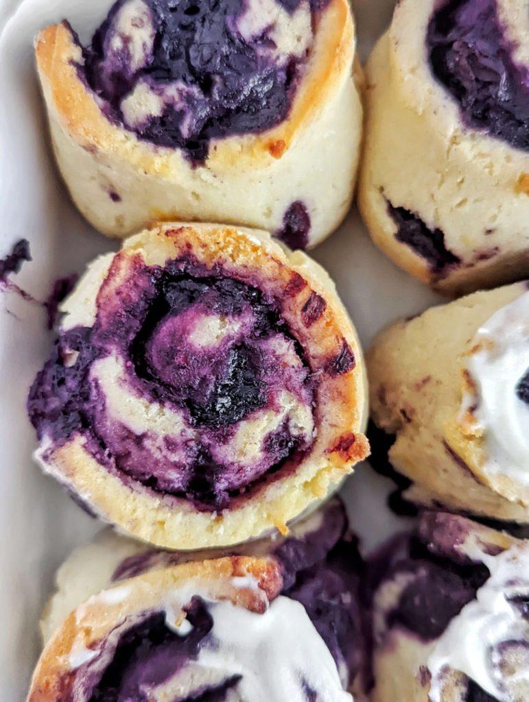 Refreshing and gooey Lemon Blueberry Protein Sweet Rolls with no sugar added. These healthy blueberry sweet rolls use protein powder and Greek yogurt and make a great meal prep breakfast or post workout treat.