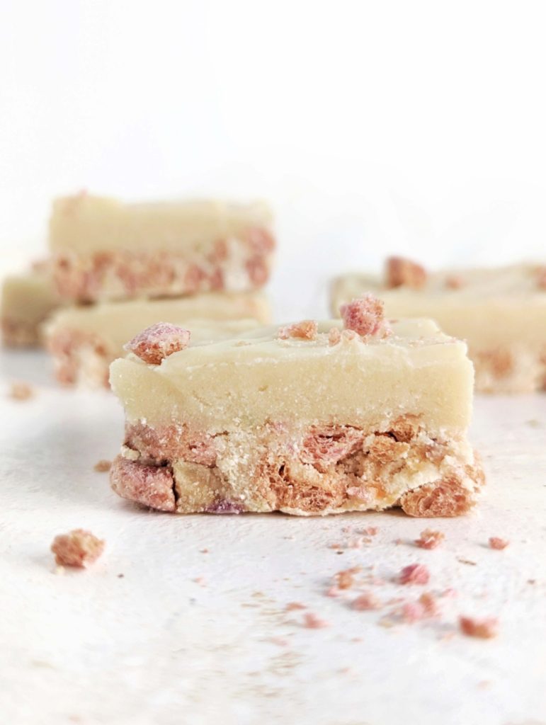 Pretty and tasty Milk and Cereal Protein Bars for a low calorie, low fat, high protein breakfast, snack or post-workout treat. This healthy milk n cereal bars recipe uses protein powder and low sugar cereal and a ton of greek yogurt for those layers!