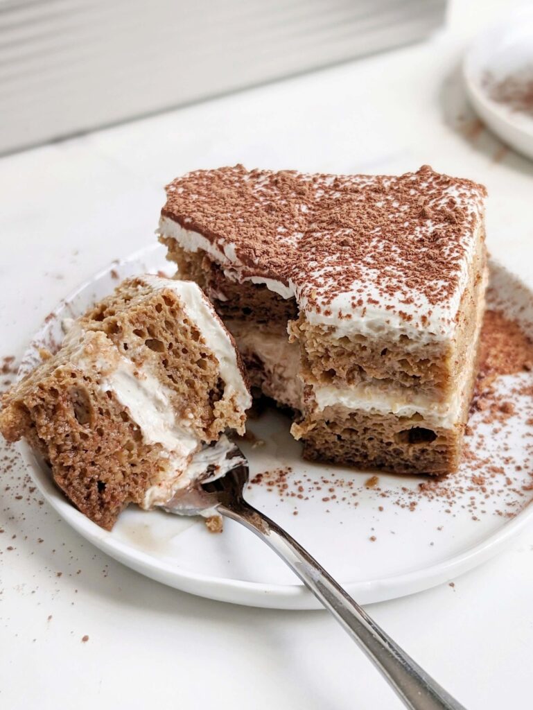 A perfect healthy Protein Tiramisu recipe with a protein cake and greek yogurt-cream cheese cream. This macro friendly tiramisu has no lady fingers, no mascarpone and no raw eggs either.