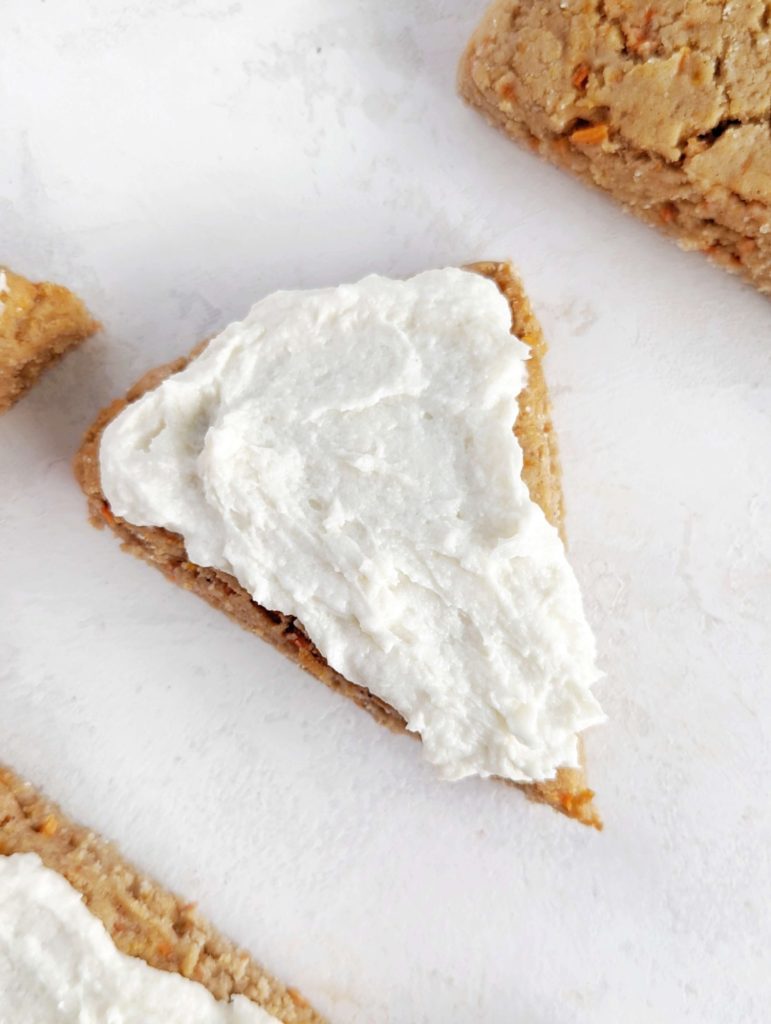 Unbelievable Carrot Cake Protein Scones with all the carrot cake flavor and a frosting too! These healthy carrot scones use protein powder for sweetener and yogurt for even more protein; Vegan and Gluten free options too!