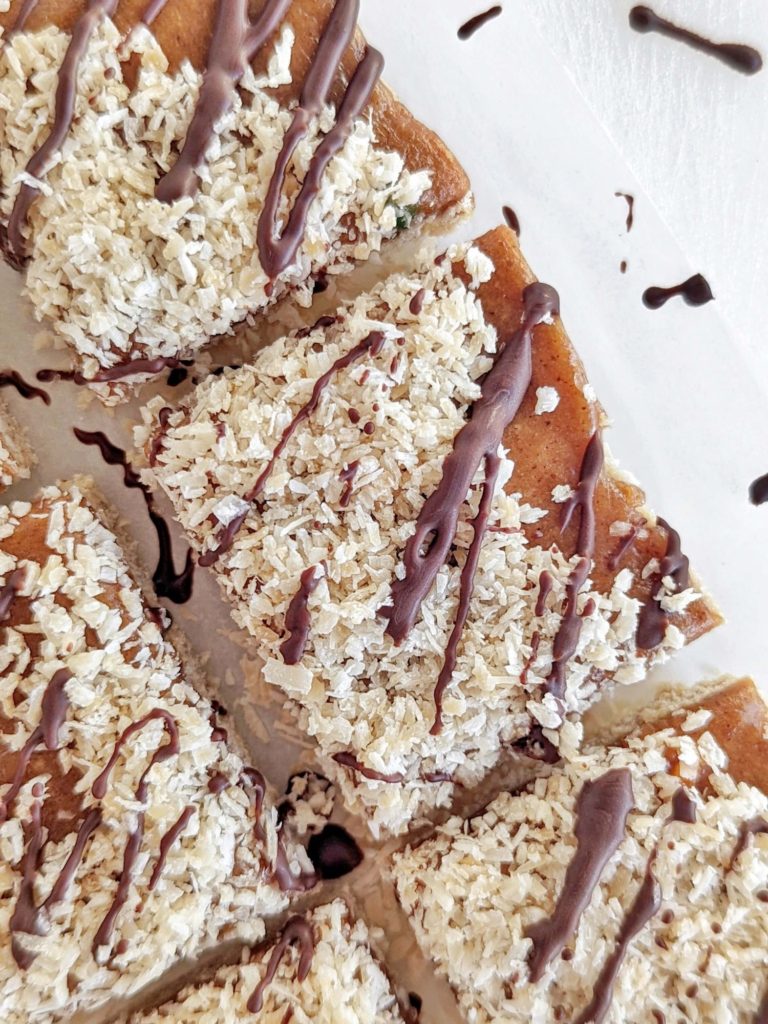 Spot on Healthy Samoa Protein Bars with a protein cookie base, low fat protein caramel, toasted coconut and sugar free chocolate drizzle. Healthy homemade Samoa cookie bars that taste just like the girl scout cookies!