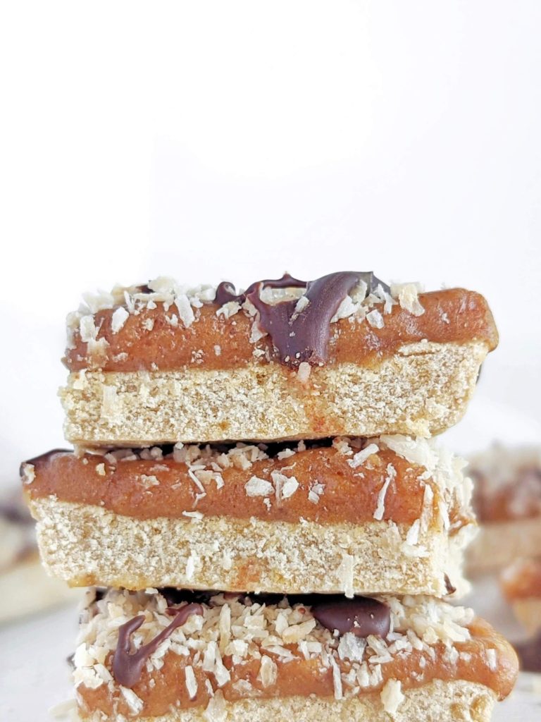 Spot on Healthy Samoa Protein Bars with a protein cookie base, low fat protein caramel, toasted coconut and sugar free chocolate drizzle. Healthy homemade Samoa cookie bars that taste just like the girl scout cookies!