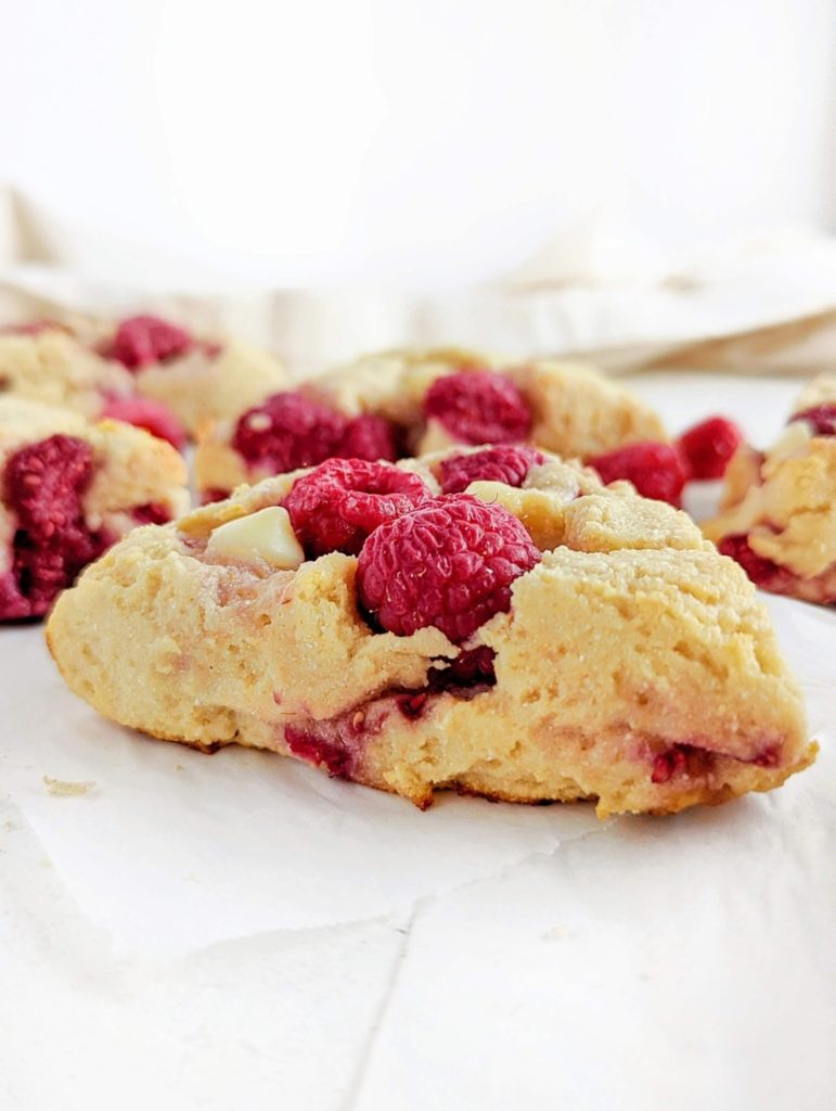 Perfectly soft and crumbly White Chocolate Raspberry Protein Scones with a ton of protein powder and greek yogurt! Healthy raspberry white chocolate scones without cream or sugar - low fat and sugar free.